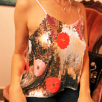 Someone wearing the Sequin Flower Embellished Crop Cami with jeans.