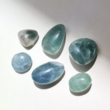Blue and green fluorite crystal tumble stones polished with natural color variations for clarity and focus