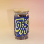 Herbal Blue Lotus Flower Tea blend featuring dried purple and yellow petals.