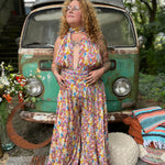 Front-facing photo of adjustable rainbow wide leg jumpsuit
