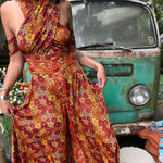 Psychedelic rainbow boho jumpsuit styled with flutter sleeves