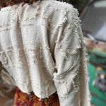 Side view of grunge boho bell sleeve cotton crop top