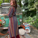 Model posing in boho hippie unisex trench coat front view