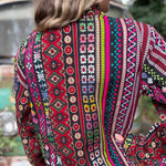 Handmade boho trench coat with earthy hippie vibes