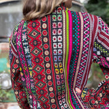 Handmade boho trench coat with earthy hippie vibes