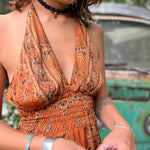 Maxi length hippie silk boho dress styled outdoors
