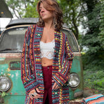 Unisex hippie style cotton trench coat worn on sidewalk