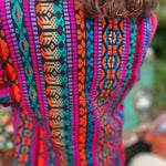 Close-up of cotton weave on bohemian trench jacket