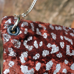 An up close image of the Garnet and Chrome Leopard Crossbody.