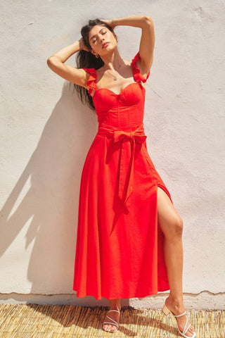 The red heaven corset flutter dress in front of a white background.