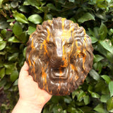 Polished chocolate opal crystal lion head carving with dark brown stone and golden orange veining