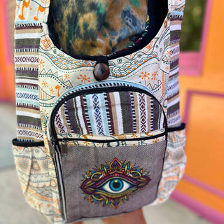 close-up of third eye embroidery on tribal sling bag