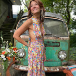 Side profile of psychedelic rainbow boho silk jumpsuit