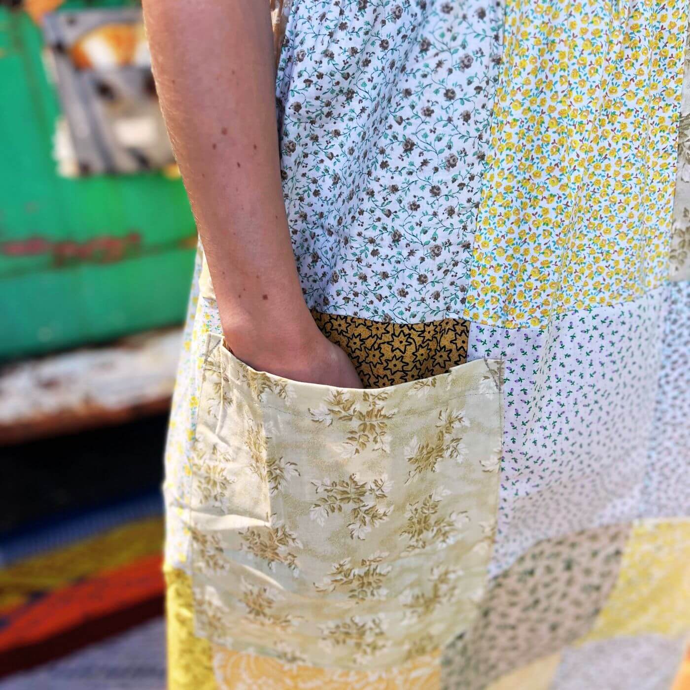 Close up pocket detail on bohemian patchwork maxi dress