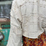 Back view of bohemian grunge bell sleeve crop top