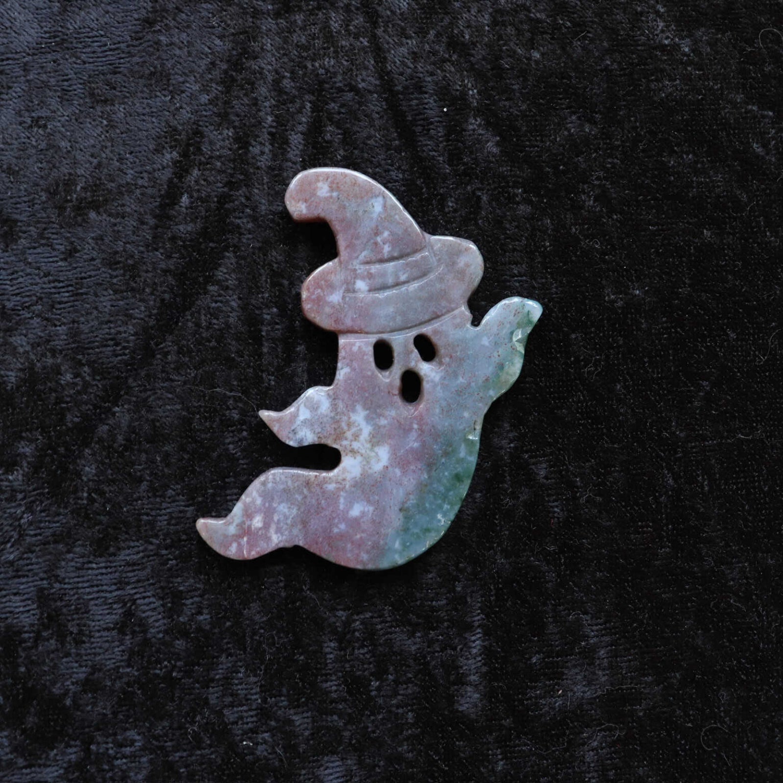 Indian moss agate ghost carving for grounding and abundance.