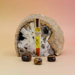 Desert Fleur Botanical Perfume rollerball – 10ml with tiger’s eye stones and geode background