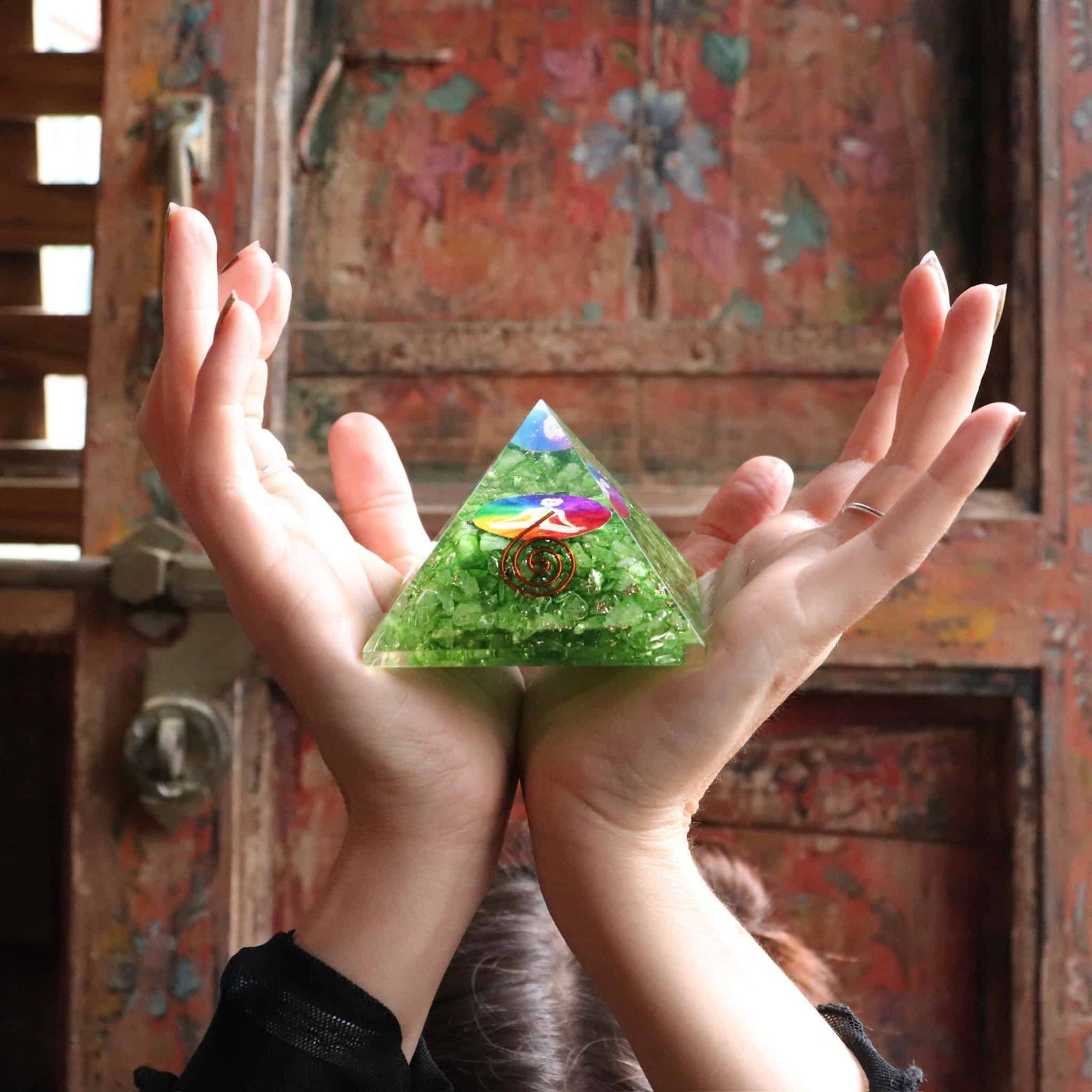 Side view of green agate orgone pyramid with copper spiral