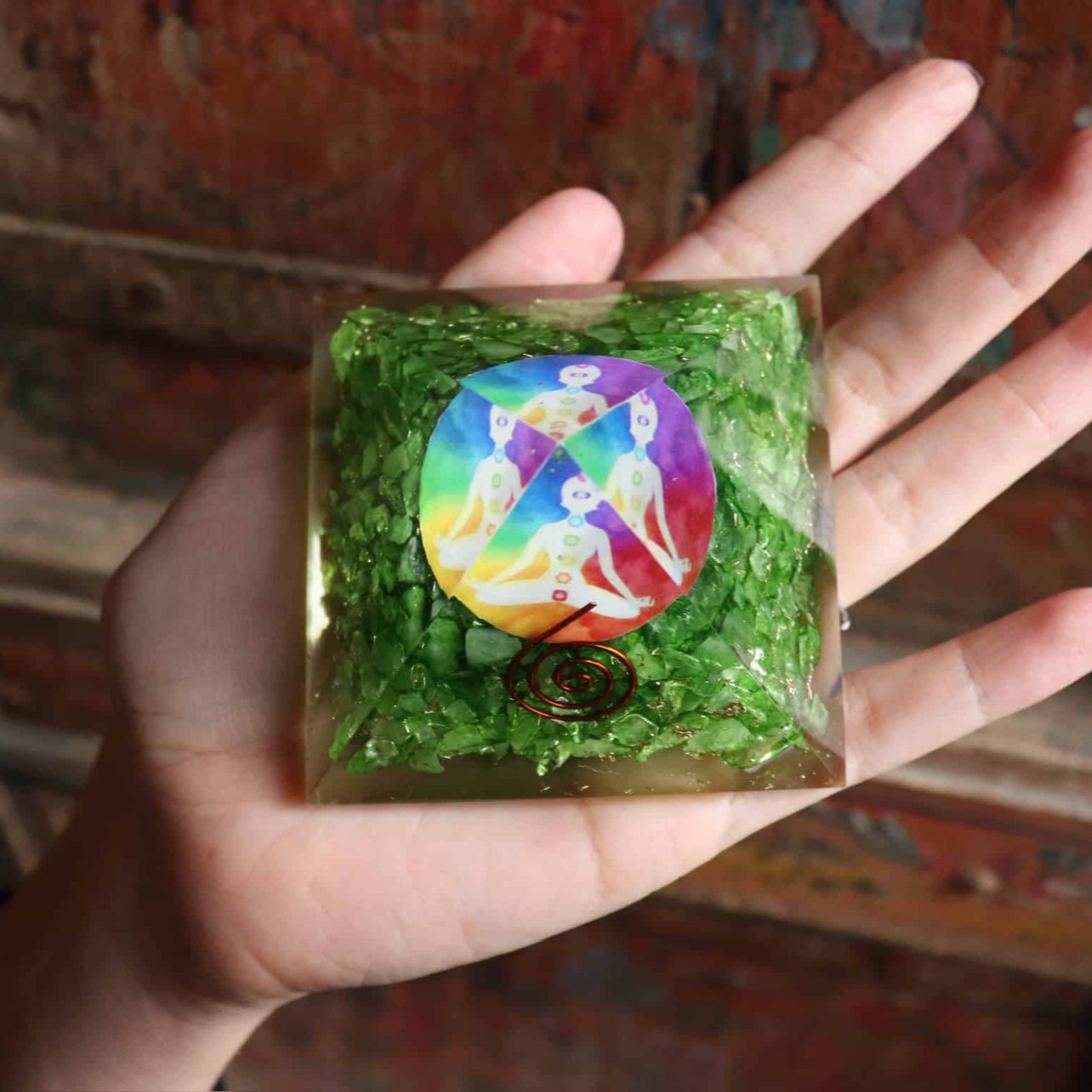 Green dyed agate orgone pyramid with rainbow chakra symbol