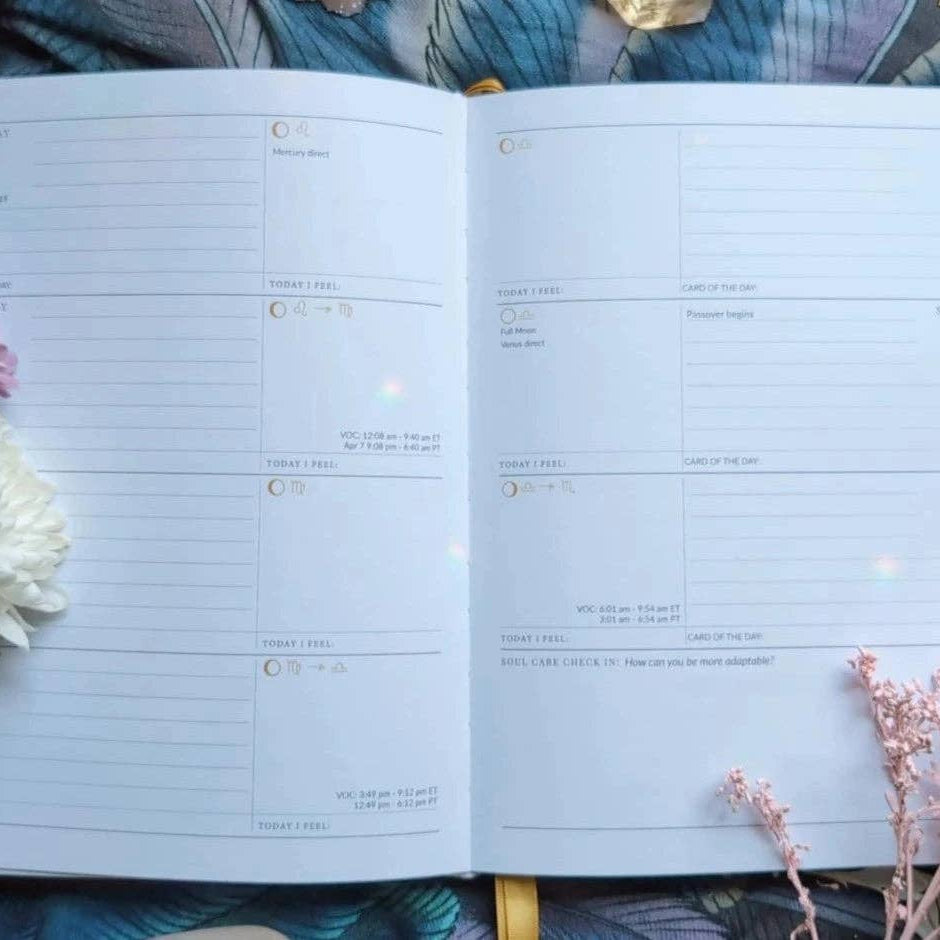 Open planner with floral decorations on a textured surface