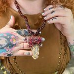 Earthy witch style mushroom crystal necklace with artisan wrapped silk fibers