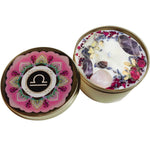 The Libra Crystal Candle opened with the lid to the right of it on a white background.
