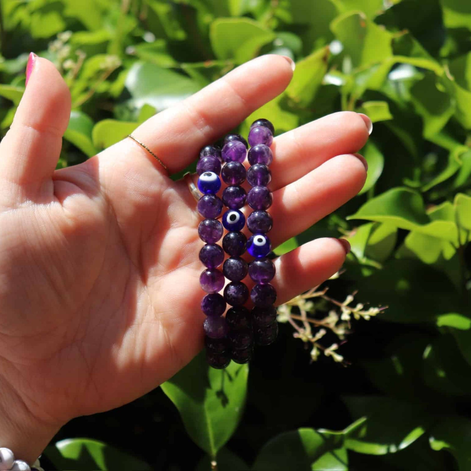 Amethyst evil eye bracelet with deep purple beads