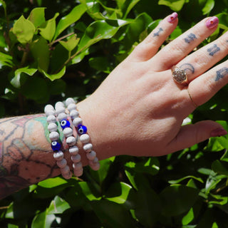 White Howlite evil eye crystal bracelet on wrist