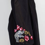 The black elephant embroidery dress on a white background.