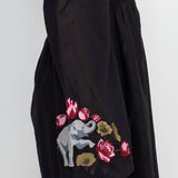 The black elephant embroidery dress on a white background.