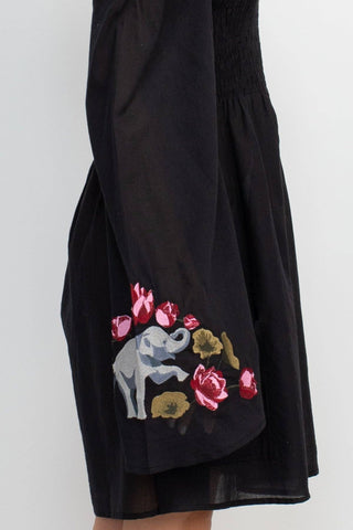 The black elephant embroidery dress on a white background.