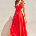 The red heaven corset flutter dress in front of a white background.