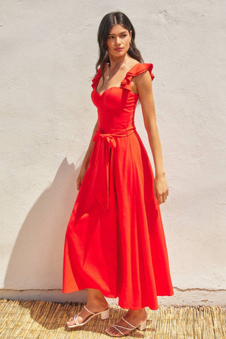 The red heaven corset flutter dress in front of a white background.