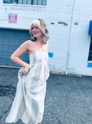 flowing cotton gauze midi dress captured in winston salem city backbround