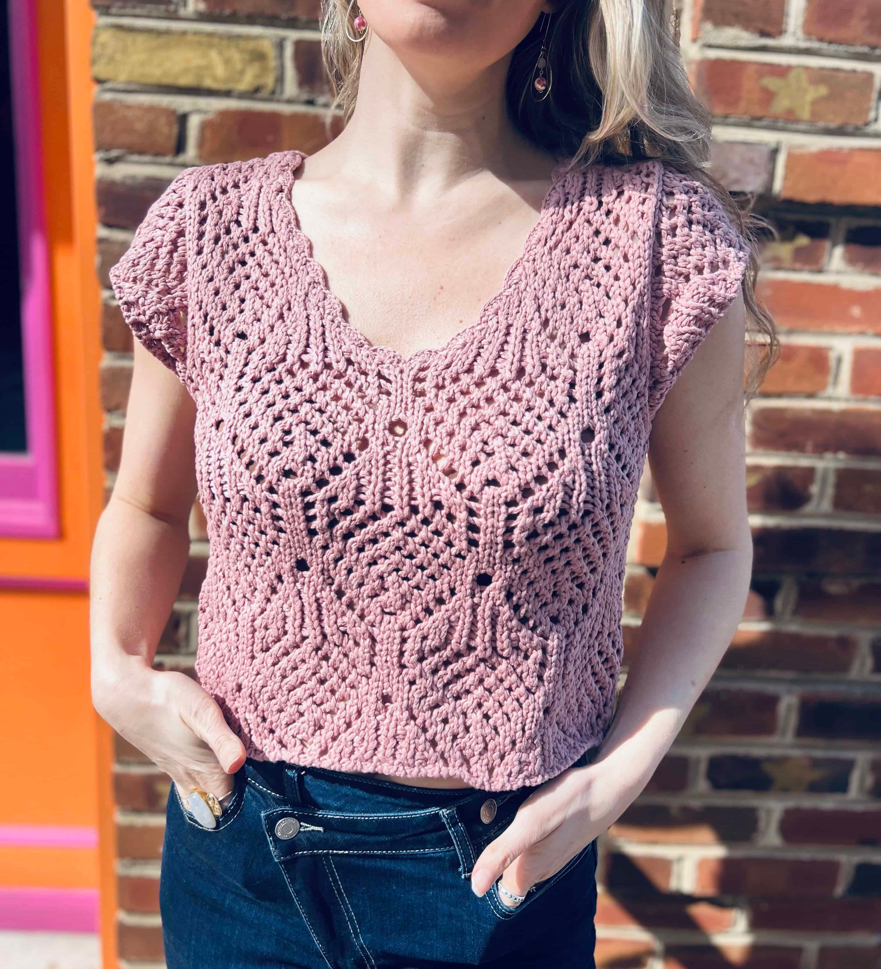woman wearing a crochet knit v neck cap sleeve top 