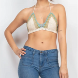 A woman wearing the off white Festive Crochet Top: One Size with jeans.