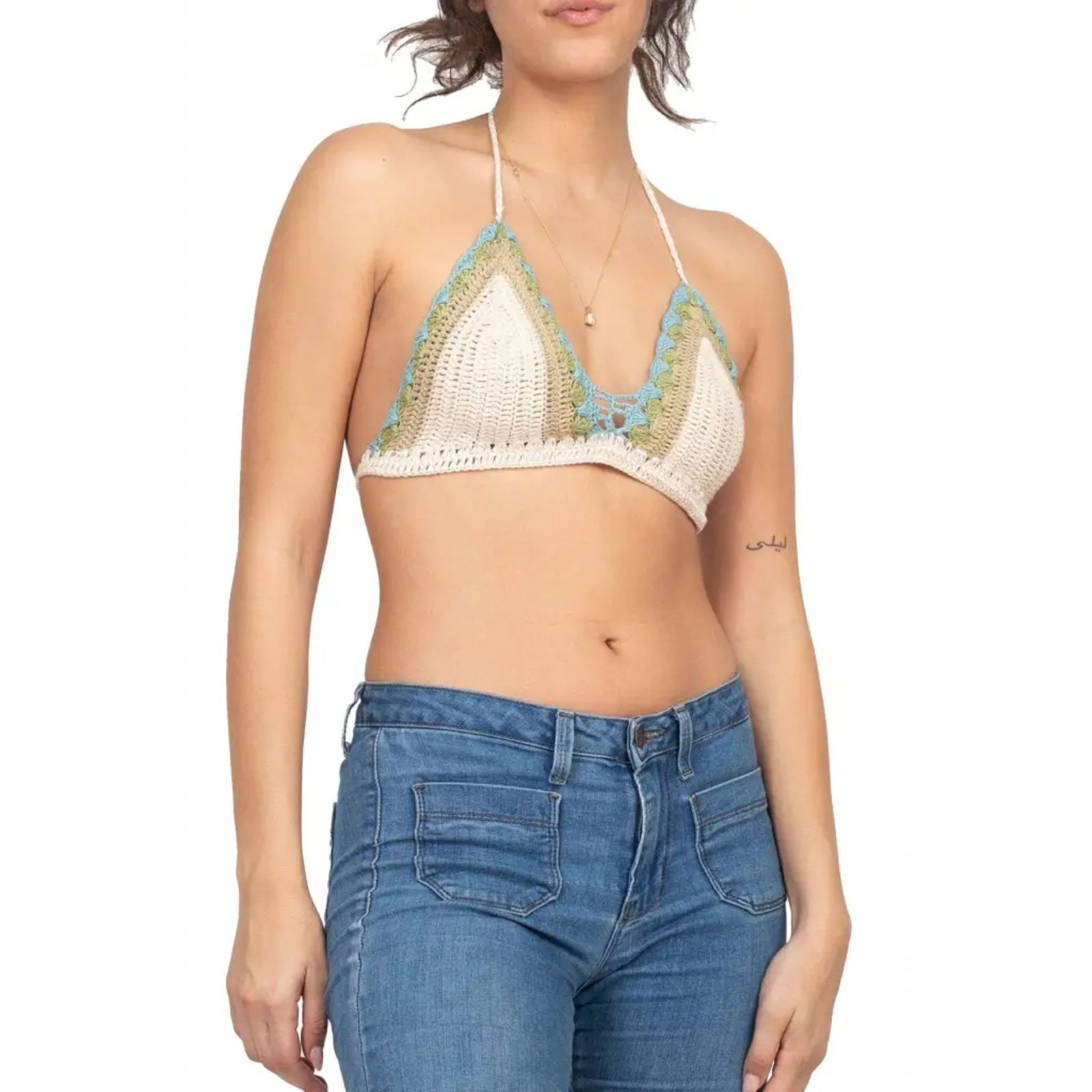 A woman wearing the off white Festive Crochet Top: One Size with jeans.