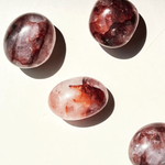 Marbled red and gray stones on a light background