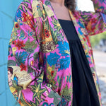 Close-up of sleeve design with Frida portrait and tropical motifs