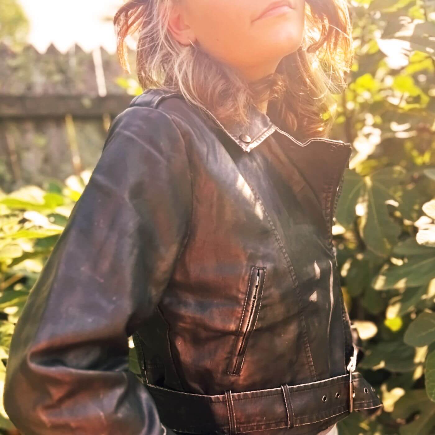 Goth style featuring a dark leather jacket with moody, romantic, and edgy fashion elements