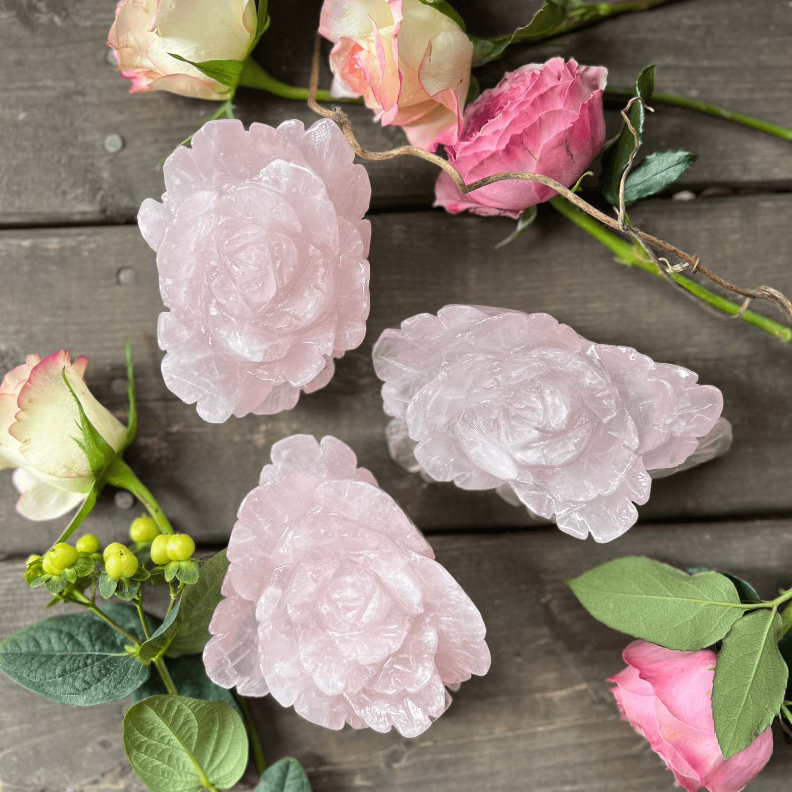 Hand carved rose quartz crystal rose gemstone carving symbolizing love and compassion