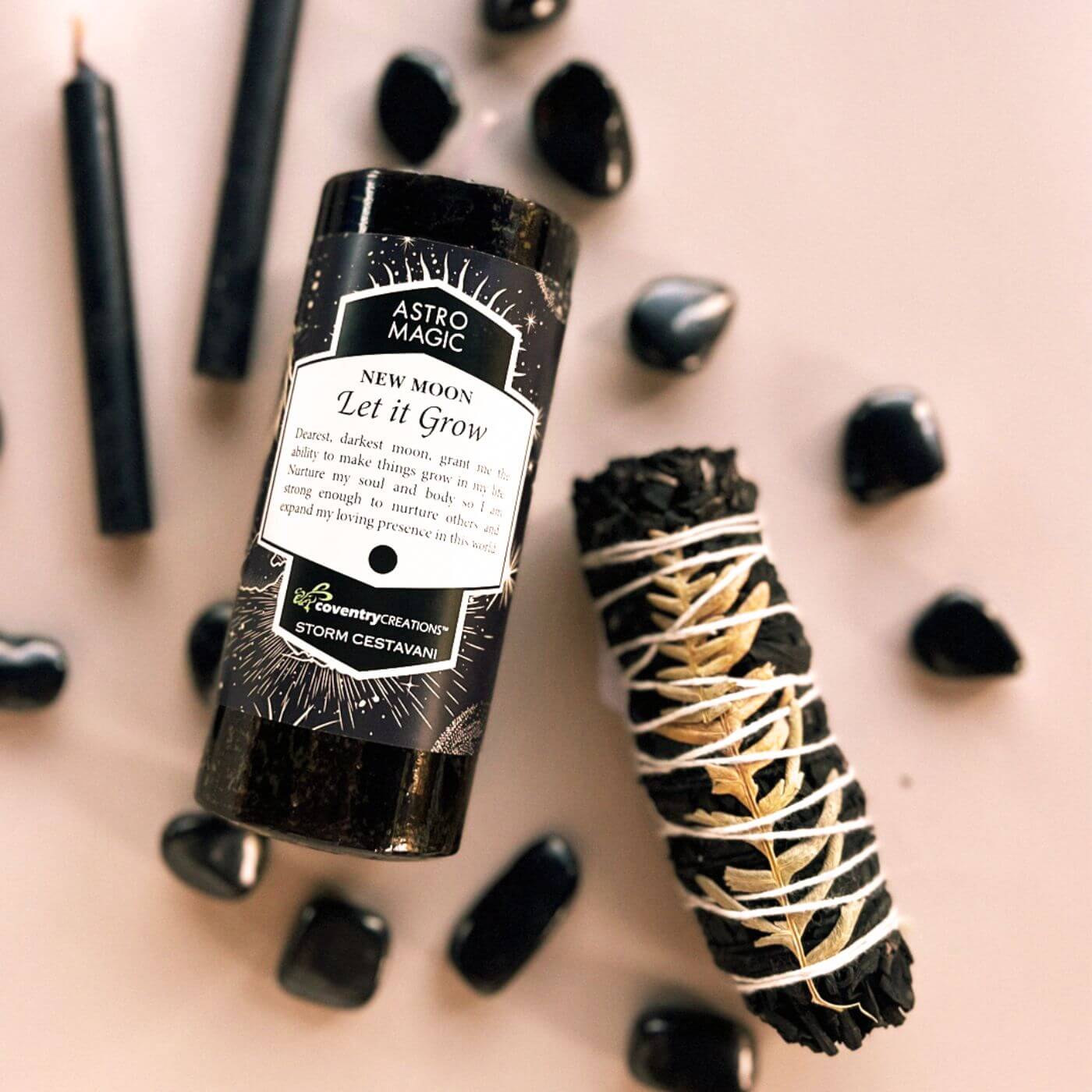 Metaphysical tools including ritual candle, smudge bundle, and healing crystals at The Boho Depot