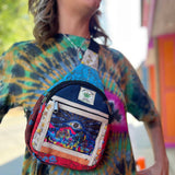 Woman wearing hemp crossbody mushroom bag with tie-dye shirt