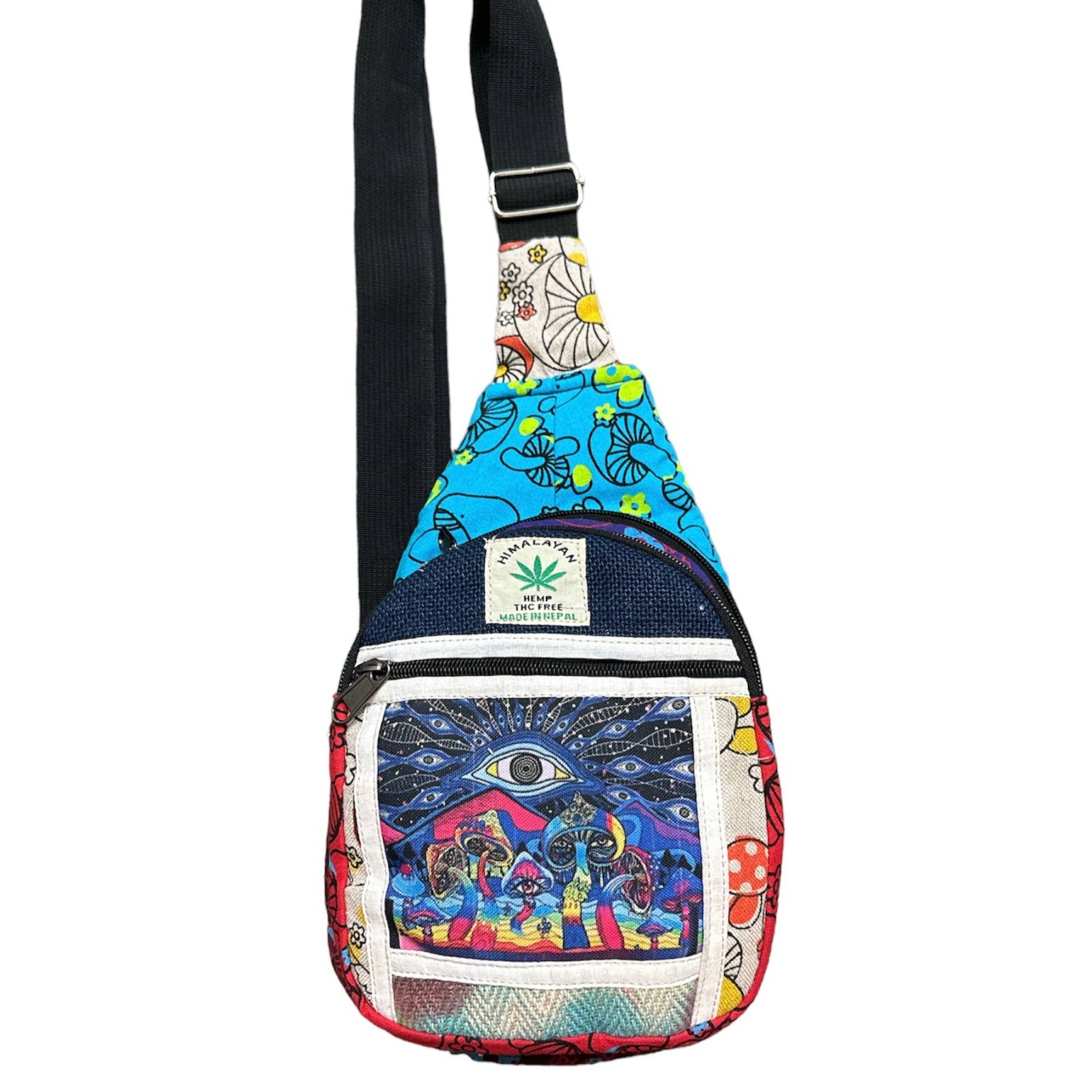 Close-up of third eye and mushroom embroidery on hemp crossbody bag on white background