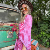 Close-up of lotus flower designs on group of boho hand-dyed kimonos