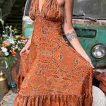 Elegant silk maxi dress styled as bohemian wedding guest outfit