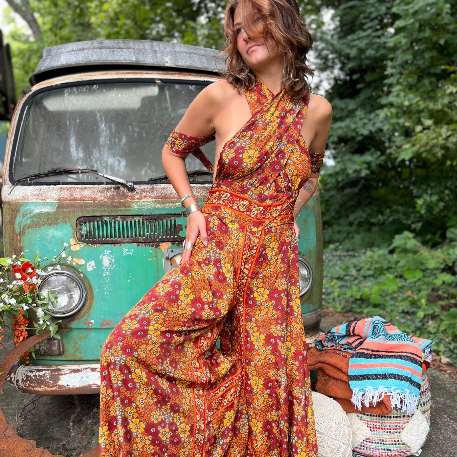 Model wearing rainbow psychedelic wide leg boho jumpsuit