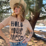 Vintage western Hold Your Horses t-shirt styled outdoors with relaxed boho vibe