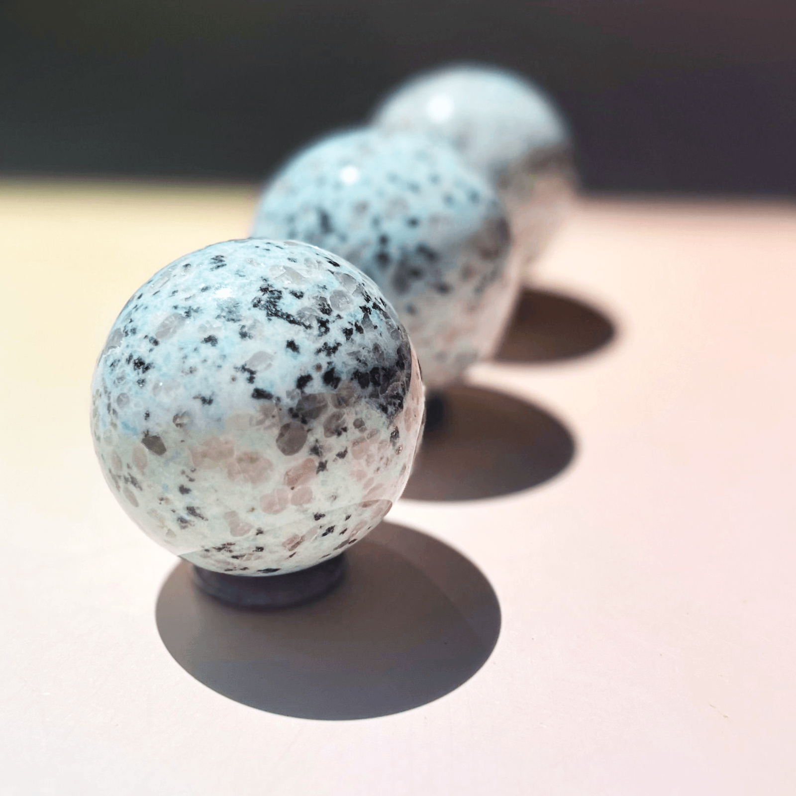 Kiwi jasper crystal sphere with green and black speckled natural pattern polished stone