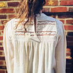 feminine woven long sleeve mock neck top styled for boho elegance